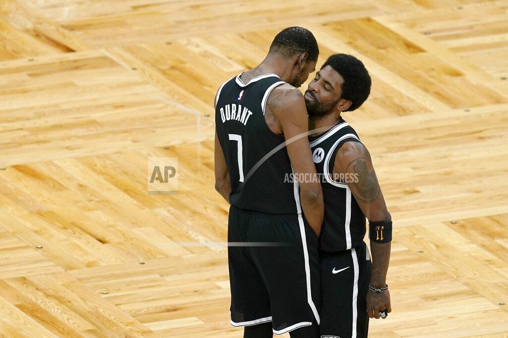 Elise Amendola Brooklyn Nets forward Kevin Durant (7) has a word with Nets guard Kyrie Irving just before the tip-off in Game 4 against the Boston Celtics during an NBA basketball first-round playoff series, Sunday, May 30, 2021, in Boston. (AP Photo/Elise Amendola)