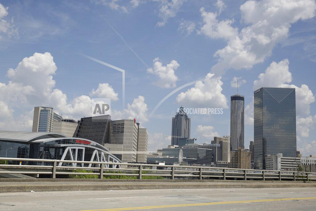 Brynn Anderson StateFarm Arena is seen near an empty street where the men's NCAA Final Four NCAA college basketball championship game was to be played on Monday, April 6, 2020, in Atlanta. The entire NCAA tournament was canceled due to the COVID-19 virus. (AP Photo/Brynn Anderson)