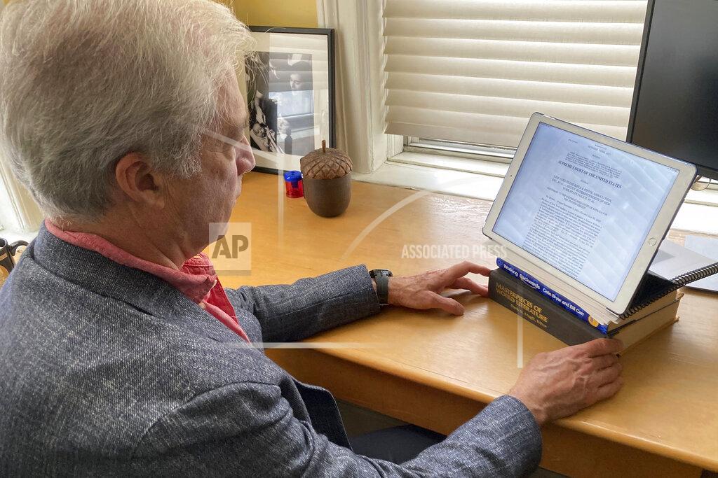 Joe Frederick Richard Aborn, president of the Citizens Crime Commission of New York City, reviews the Supreme Court decision striking down New York's conceal carry gun law, in New York, Thursday, June 23, 2022. (AP Photo/Joe Frederick)