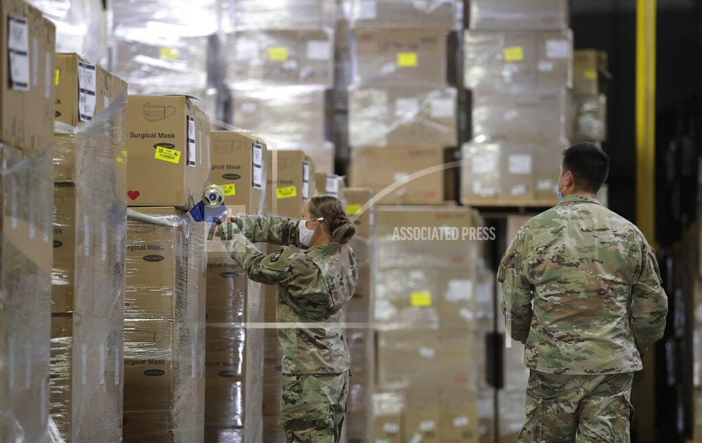 Eric Gay Members of the National Guard work with Personal Protective Equipment during the coronavirus pandemic at a Texas Division of Emergency Management Warehouse, Tuesday, Aug. 4, 2020, in San Antonio. (AP Photo/Eric Gay)