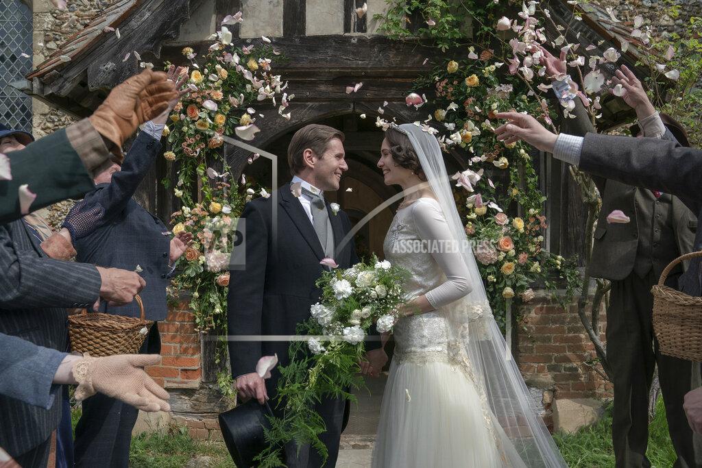 Ben Blackall This image released by Focus Features shows Allen Leech as Tom Branson, left, and Tuppence Middleton as Lucy Smith, in a scene from "Downton Abbey: A New Era." (Ben Blackall/Focus Features via AP)
