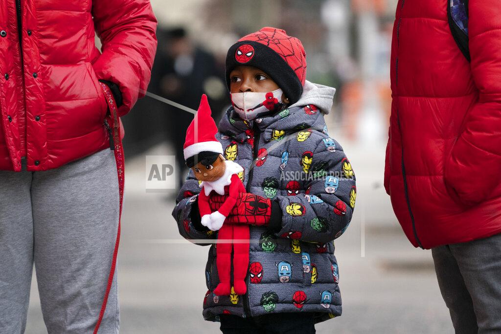 Mark Lennihan Jayceon Melendez arrives at P.S. 134 Henrietta Szold Elementary School, Monday, Dec. 7, 2020, in New York. Public schools reopened for in-school learning Monday after being closed since mid-November. (AP Photo/Mark Lennihan)