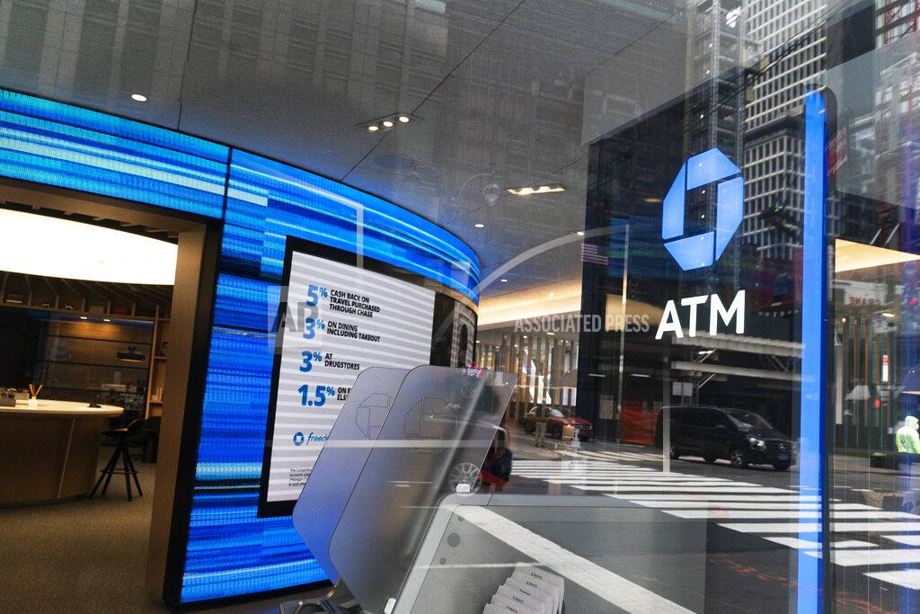 Mark Lennihan A Chase ATM is open, Wednesday, Jan. 13, 2021 in New York. JPMorgan Chase & Co., the nation’s largest bank by assets, said its fourth quarter profits jumped by 42% from a year earlier, as the firm’s investment bank division had a stellar quarter and the bank’s balance sheet improved despite the pandemic. (AP Photo/Mark Lennihan)