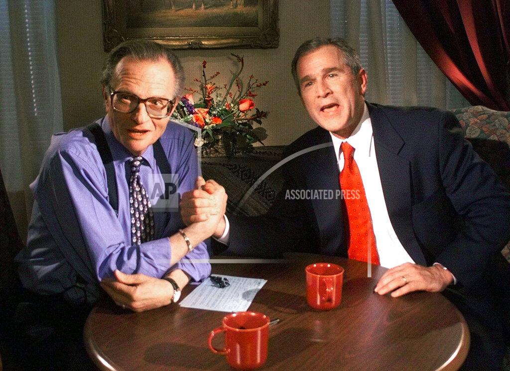 John Russell FILE - In this Dec. 16, 1999 file photo, Republican presidential candidate Texas Gov. George W. Bush jokes with CNN's Larry King after finishing the "Larry King Live" show from the Wildhorse Saloon in Nashville, Tenn. King, who interviewed presidents, movie stars and ordinary Joes during a half-century in broadcasting, has died at age 87. Ora Media, the studio and network he co-founded, tweeted that King died Saturday, Jan. 23, 2021 morning at Cedars-Sinai Medical Center in Los Angeles. (AP Photo/John Russell, file)