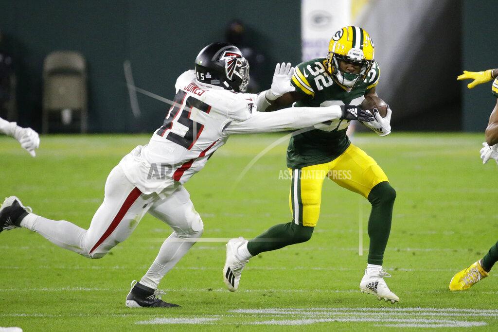 Mike Roemer Green Bay Packers' Tyler Ervin (32) is tackled by Atlanta Falcons' Deion Jones (45) during the first half of an NFL football game, Monday, Oct. 5, 2020, in Green Bay, Wis. (AP Photo/Mike Roemer)