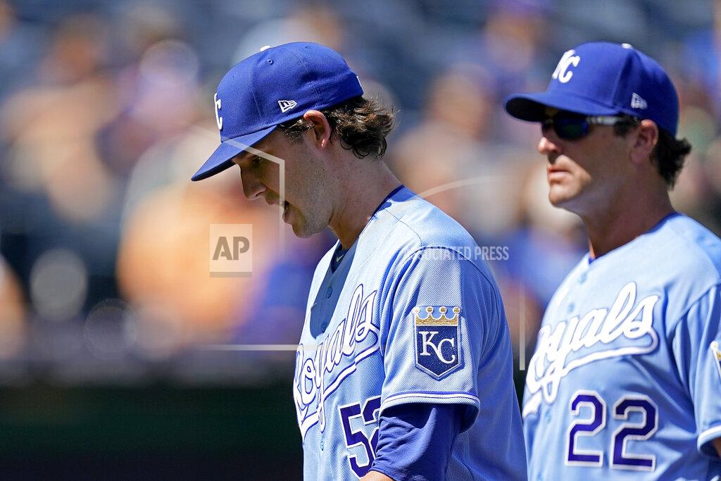 Charlie Riedel Kansas City Royals starting pitcher Daniel Lynch is followed to the dugout by Mike Matheny (22) as he comes out of the game during the third inning of a baseball game Thursday, Sept. 16, 2021, in Kansas City, Mo. (AP Photo/Charlie Riedel)