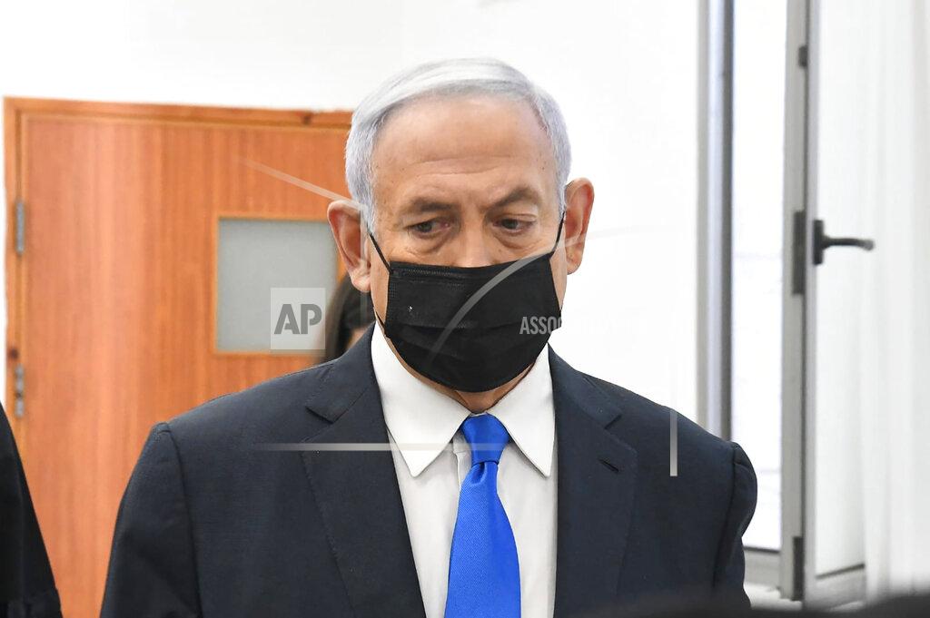 Reuven Castro Israeli Prime Minister Benjamin Netanyahu arrives to a hearing at the district court in Jerusalem, Monday, Feb. 8, 2021. Netanyahu appeared in a Jerusalem courtroom Monday to respond formally to corruption charges just weeks before national elections in which he hopes to extend his 12-year rule. (AP Photo/Reuven Castro, Pool)