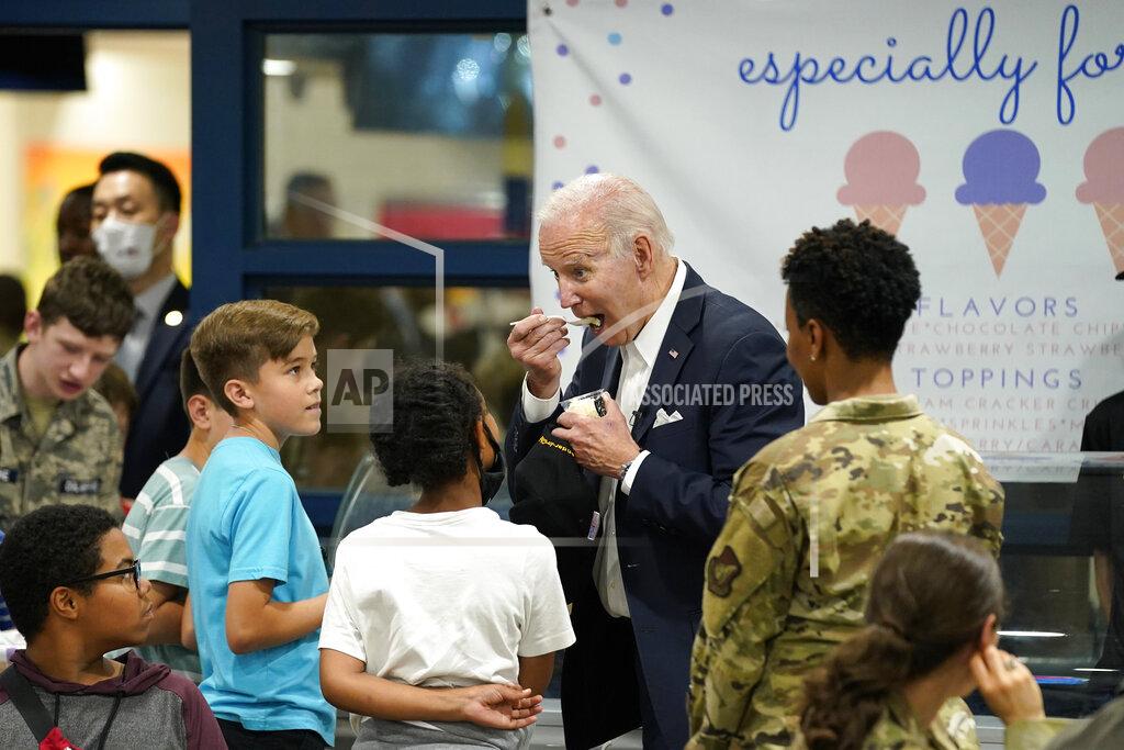 Evan Vucci U.S. President Joe Biden eats ice cream as Biden meets with American service members and their family at Osan Air Base, Sunday, May 22, 2022, in Pyeongtaek, South Korea. (AP Photo/Evan Vucci)