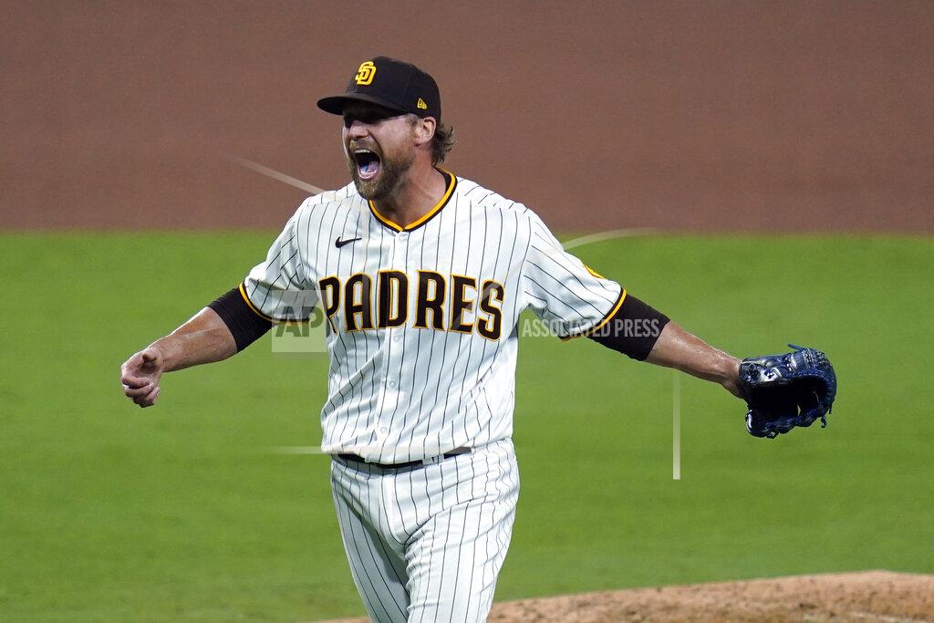 Gregory Bull San Diego Padres relief pitcher Trevor Rosenthal celebrates after the Padres defeated the St. Louis Cardinals 4-0 in Game 3 of a National League wild-card baseball series Friday, Oct. 2, 2020, in San Diego. The Padres advanced to the NL Division Series. (AP Photo/Gregory Bull)