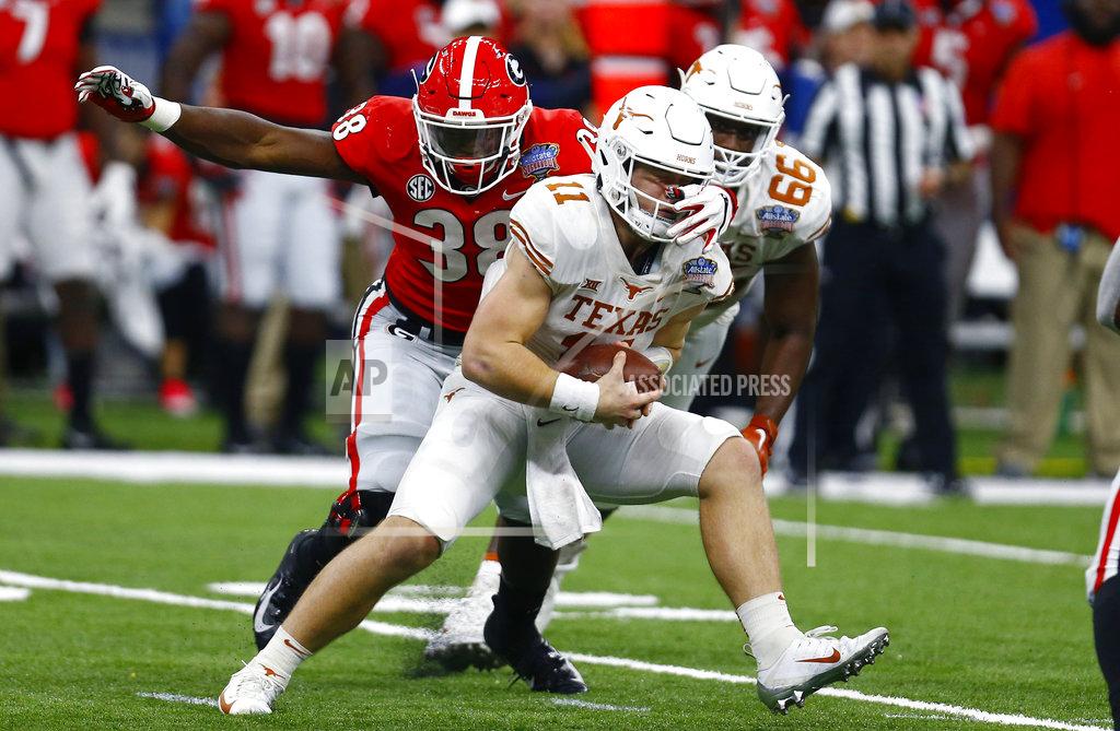 Butch Dill Georgia linebacker Azeez Ojulari (38) tries t sack Texas quarterback Sam Ehlinger (11) as he eludes him to gain first down, in the first half of the Sugar Bowl NCAA college football game in New Orleans, Tuesday, Jan. 1, 2019. (AP Photo/Butch Dill)