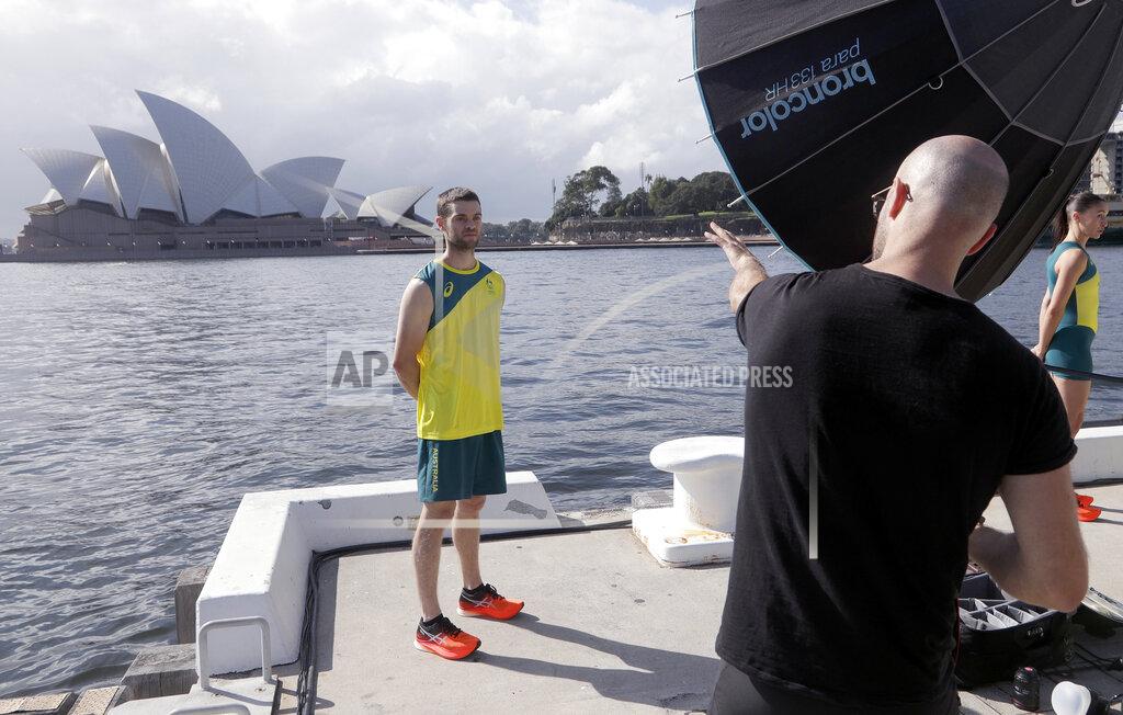 Rick Rycroft Tom O'Halloran poses for a photographer after Olympic hopefuls were presented their green and gold competition kits in Sydney Wednesday, March 31, 2021, during the unveiling of the uniforms the Australian team will wear during the Tokyo Olympic games. (AP Photo/Rick Rycroft)