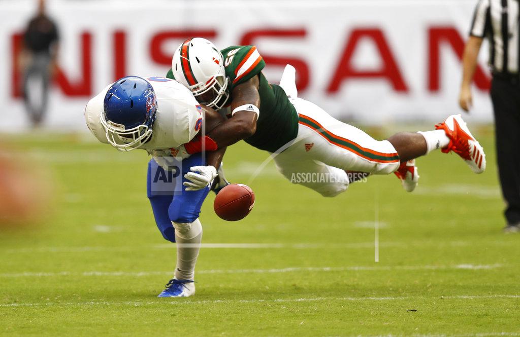 Brynn Anderson Miami linebacker Michael Pinckney, right, tackles Savannah State defensive back Michael O'Neal during the first half an NCAA college football game, Saturday, Sept. 8, 2018, in Miami Gardens, Fla. (AP Photo/Brynn Anderson)