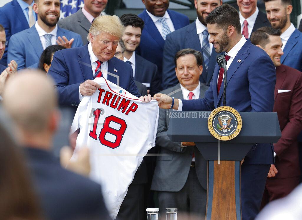 Pablo Martinez Monsivais Outfielder J.D. Martinez, right, presents a team jersey to President Donald Trump, left, during a ceremony on the South Lawn of the White House in Washington, Thursday, May 9, 2019, where Trump honored the 2018 World Series Baseball Champion Boston Red Sox. (AP Photo/Pablo Martinez Monsivais)