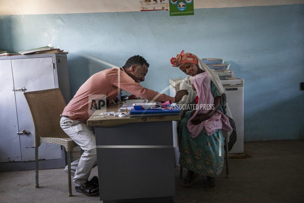Nariman El-Mofty Dr. Tewodros Tefera treats a patient at the Sudanese Red Crescent Clinic in Hamdayet, Sudan, on March 17, 2021. (AP Photo/Nariman El-Mofty)