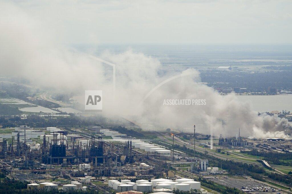 David J. Phillip A chemical fire burns at a facility during the aftermath of Hurricane Laura Thursday, Aug. 27, 2020, near Lake Charles, La. (AP Photo/David J. Phillip)