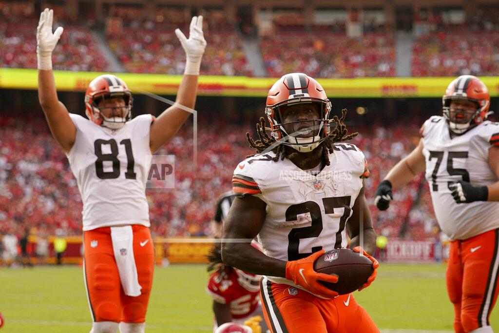 Charlie Riedel Cleveland Browns running back Kareem Hunt (27) scores as teammate Austin Hooper (81) celebrates during the second half of an NFL football game against the Kansas City Chiefs Sunday, Sept. 12, 2021, in Kansas City, Mo. (AP Photo/Charlie Riedel)