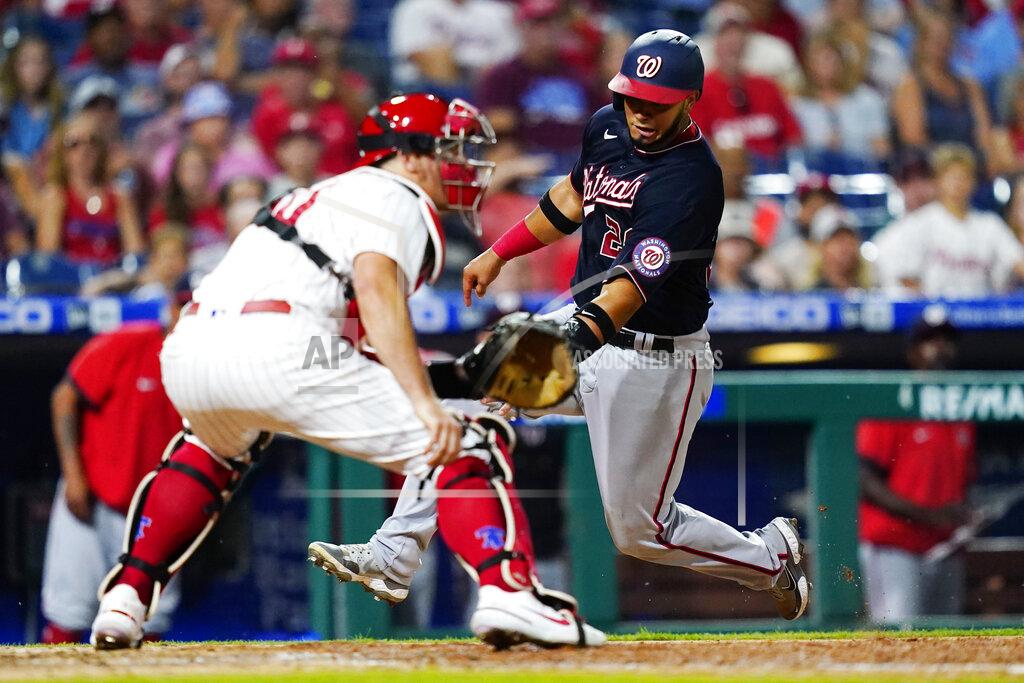 Matt Slocum Washington Nationals' Keibert Ruiz, right, scores past Philadelphia Phillies catcher J.T. Realmuto on a two-run double by Luis Garcia during the seventh inning of a baseball game, Wednesday, July 6, 2022, in Philadelphia. (AP Photo/Matt Slocum)
