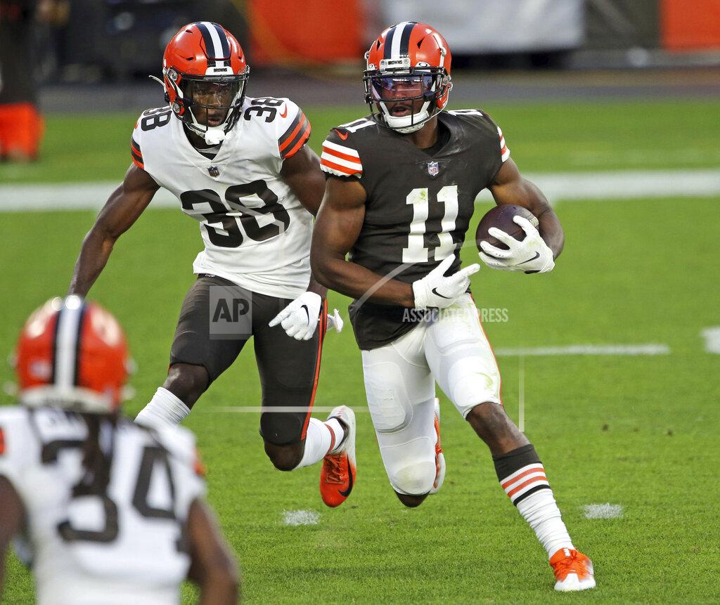 Joshua Gunter Cleveland Browns wide receiver Donovan Peoples-Jones runs after a catch next to cornerback A.J. Green during the NFL football team's scrimmage Friday, Sept. 4, 2020, in Cleveland. (Joshua Gunter/Cleveland.com via AP)