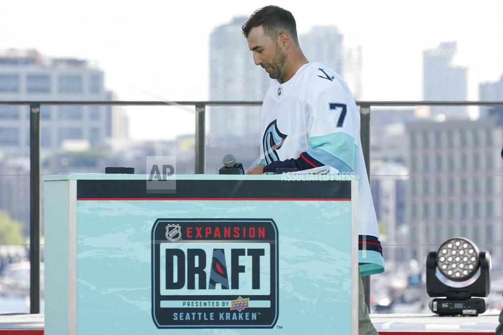 Ted S. Warren Jordan Eberle, a forward from the New York Islanders, walks off stage after being introduced as a new player for the Seattle Kraken, Wednesday, July 21, 2021, during the Kraken's NHL hockey expansion draft event in Seattle. (AP Photo/Ted S. Warren)