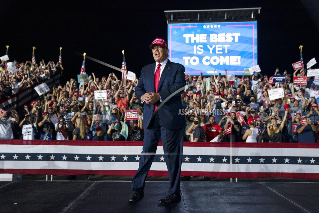 Evan Vucci President Donald Trump arrives for a campaign rally at Miami-Opa-locka Executive Airport, Monday, Nov. 2, 2020, in Opa-locka, Fla. (AP Photo/Evan Vucci)