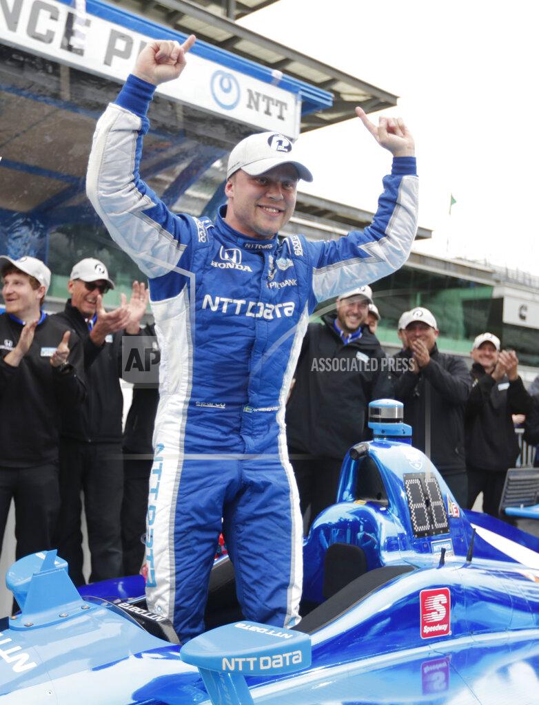 Michael Conroy Felix Rosenqvist, of Sweden, celebrates after winning the pole during qualifications for the Indy GP IndyCar auto race at Indianapolis Motor Speedway, Friday, May 10, 2019 in Indianapolis. (AP Photo/Michael Conroy)