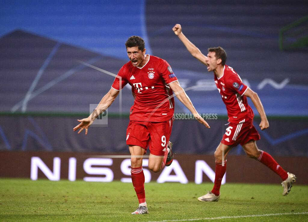 Franck Fife Bayern's Robert Lewandowski celebrates after scoring his side's third goal during the Champions League semifinal soccer match between Lyon and Bayern at the Jose Alvalade stadium in Lisbon, Portugal, Wednesday, Aug. 19, 2020. (Franck Fife/Pool via AP)