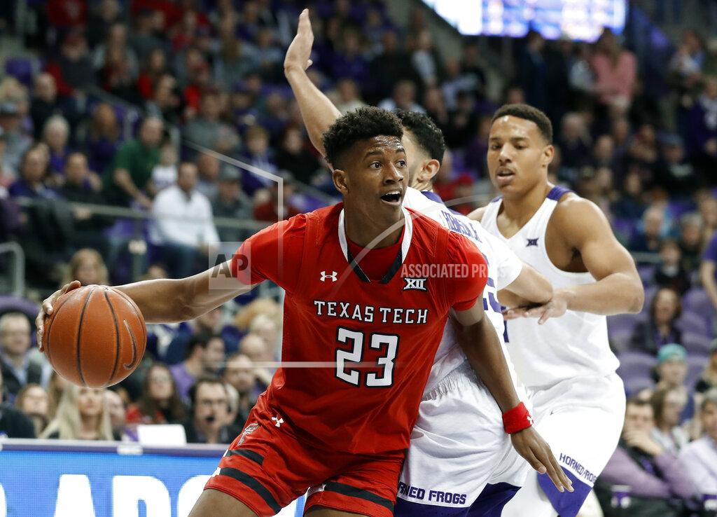 Tony Gutierrez Texas Tech guard Jarrett Culver (23) gets through the defense of TCU's Alex Robinson, center rear, and Desmond Bane, right rear, in the first half of an NCAA college basketball game in Fort Worth, Texas, Saturday, March 2, 2019. (AP Photo/Tony Gutierrez)