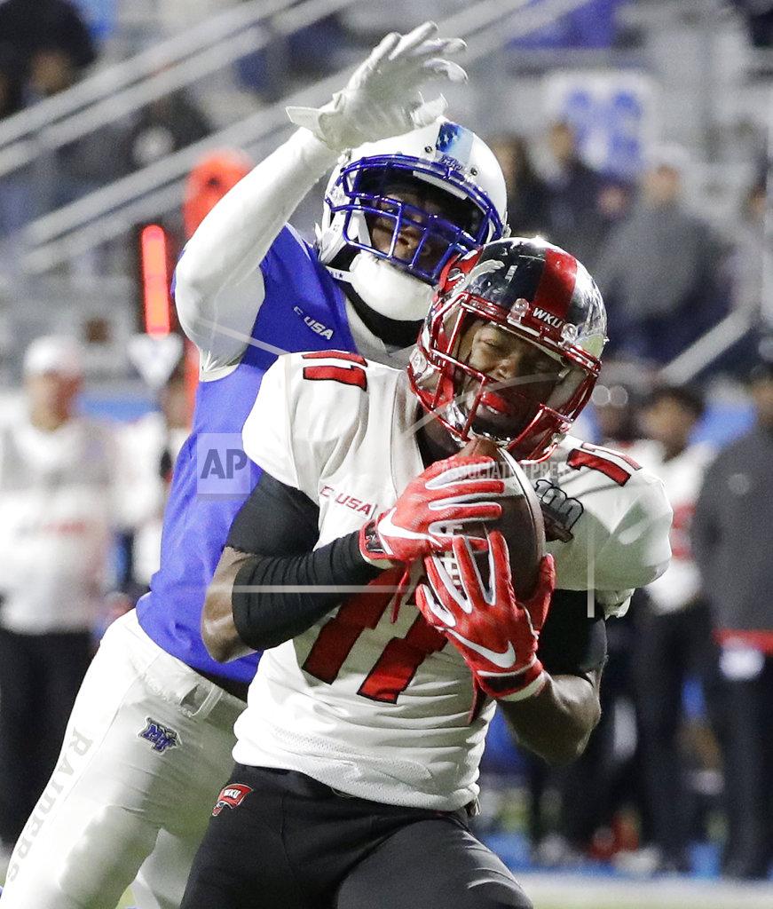 Mark Humphrey Western Kentucky wide receiver Lucky Jackson (11) catches a 46-yard touchdown pass as he is defended by Middle Tennessee's Chris Stamps during the second half of an NCAA college football game Friday, Nov. 2, 2018, in Murfreesboro, Tenn. Middle Tennessee won 29-10. (AP Photo/Mark Humphrey)