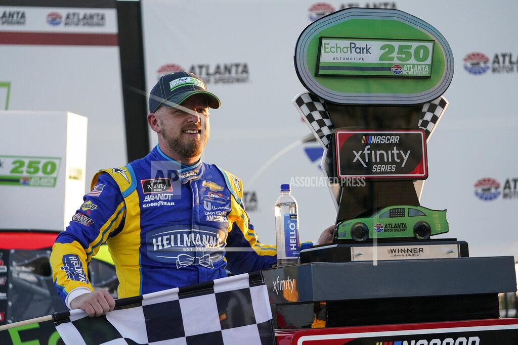 Brynn Anderson NASCAR driver Justin Allgaier poses with a trophy after he wins a NASCAR Xfinity Series at Atlanta Motor Speedway on Saturday, March 20, 2021, in Hampton, Ga. (AP Photo/Brynn Anderson)