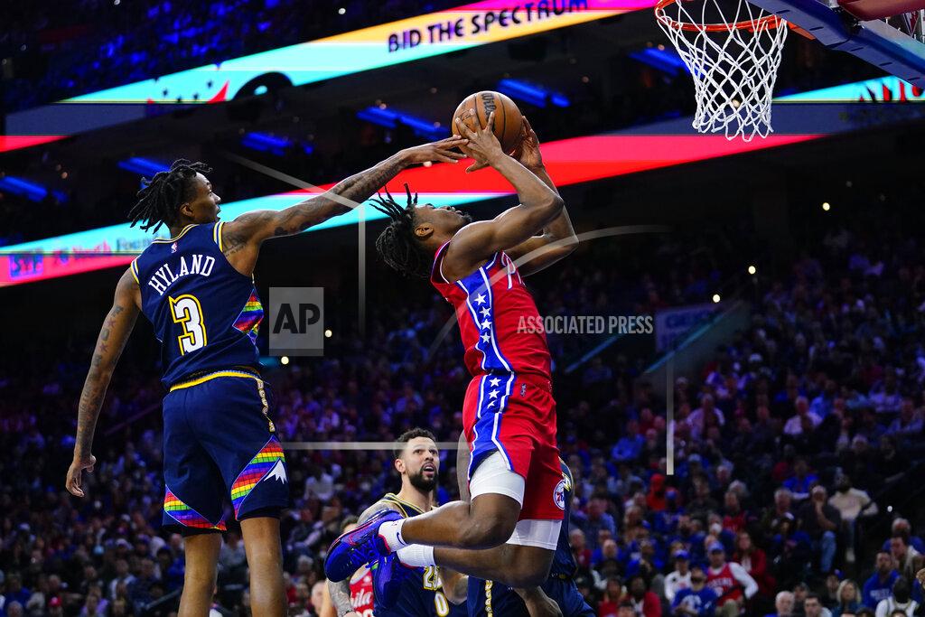 Matt Slocum Philadelphia 76ers' Tyrese Maxey, right, goes up for a shot against Denver Nuggets' Bones Hyland during the second half of an NBA basketball game, Monday, March 14, 2022, in Philadelphia. (AP Photo/Matt Slocum)