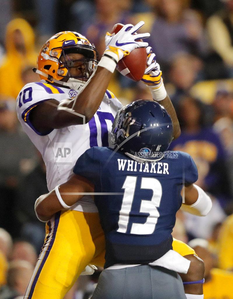 Gerald Herbert LSU wide receiver Stephen Sullivan (10) pulls in a touchdown reception over Rice cornerback Collin Whitaker (13) in the first half of an NCAA college football game in Baton Rouge, La., Saturday, Nov. 17, 2018. (AP Photo/Gerald Herbert)