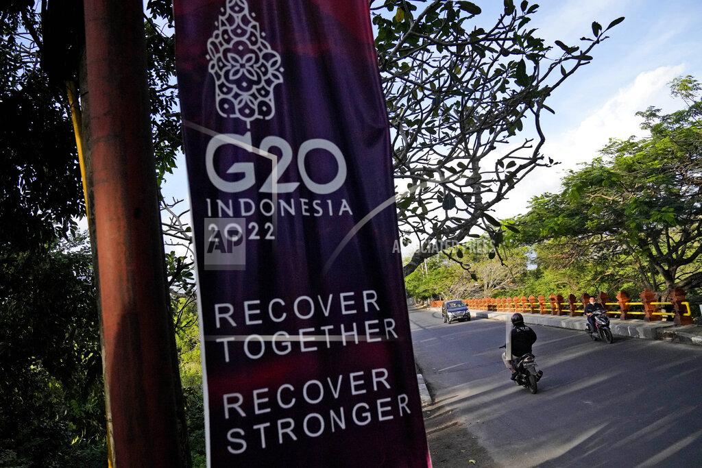 Dita Alangkara Motorists ride past a G20 banner in Nusa Dua, Bali, Indonesia, Thursday, July 7, 2022. Foreign ministers from the Group of 20 leading rich and developing nations are gathering in Indonesia's resort island of Bali for talks bound to be dominated by the conflict in Ukraine despite an agenda focused on global cooperation and food and energy security. (AP Photo/Dita Alangkara)
