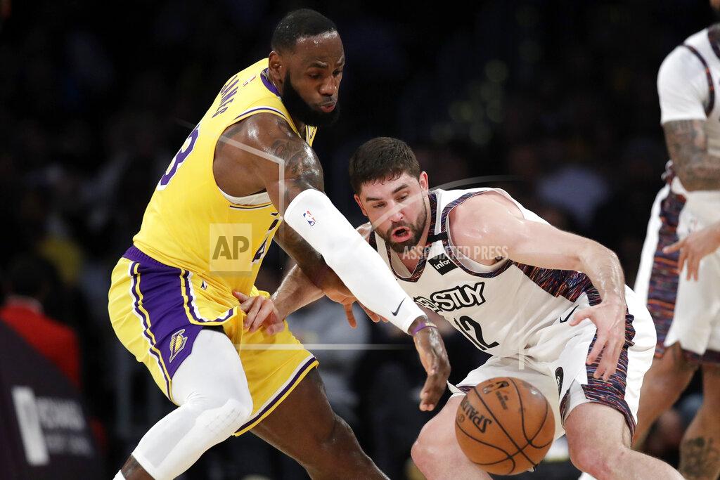 Marcio Jose Sanchez Los Angeles Lakers' LeBron James, left, strips the ball from Brooklyn Nets' Joe Harris during the first half of an NBA basketball game Tuesday, March 10, 2020, in Los Angeles. (AP Photo/Marcio Jose Sanchez)