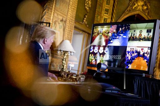 FILE - President Donald Trump speaks during a Christmas Eve video teleconference with members of the military at his Mar-a-Lago estate in Palm Beach, Fla., Tuesday, Dec. 24, 2019. A Las Vegas city councilwoman has been spending thousands on television ads in her quest to be Nevada's next governor. But Michele Fiore isn't only airing those ads to be seen by millions of Nevada voters. She's also targeting an audience of one in faraway Florida. (AP Photo/Andrew Harnik.File)