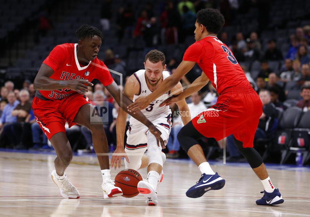 Rich Pedroncelli Saint Mary's Jordan Ford is double-teamed by Fresno State's Aguir Agau, left, and Jarred Hyder during the first half of an NCAA college basketball game in Sacramento, Calif., Wednesday, Nov. 20, 2019. (AP Photo/Rich Pedroncelli)
