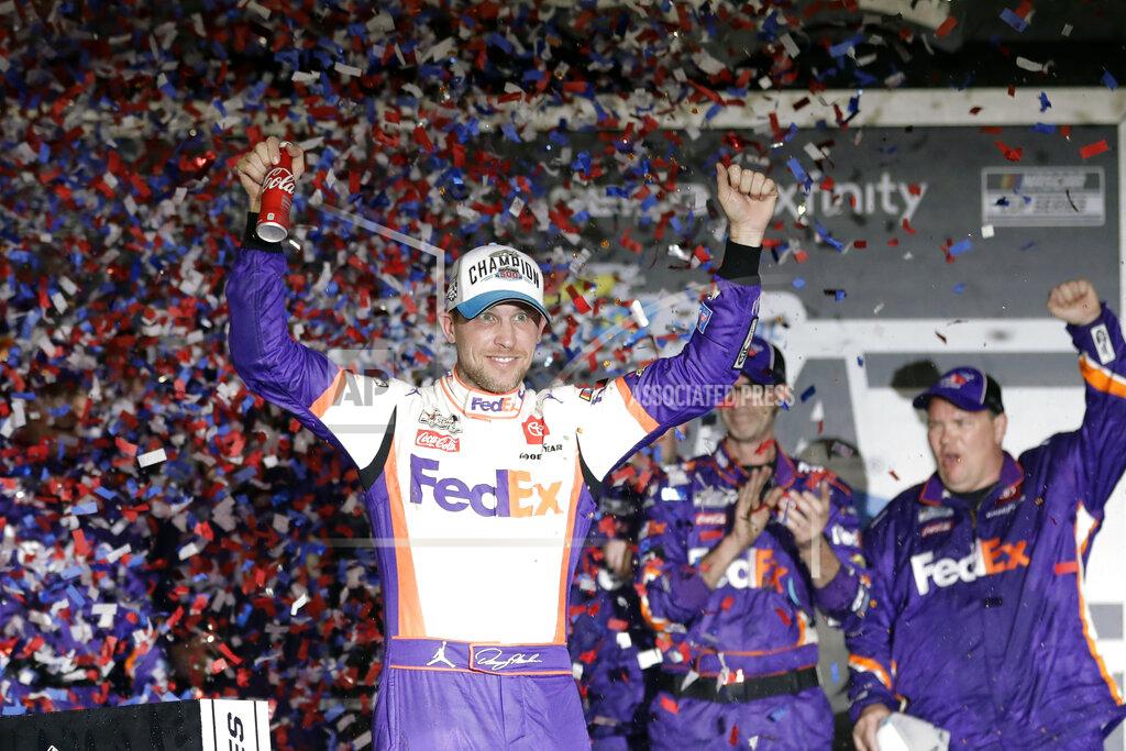 John Raoux Denny Hamlin celebrates in Victory Lane after winning the NASCAR Daytona 500 auto race at Daytona International Speedway, Monday, Feb. 17, 2020, in Daytona Beach, Fla. Sunday's race was postponed because of rain. (AP Photo/John Raoux)
