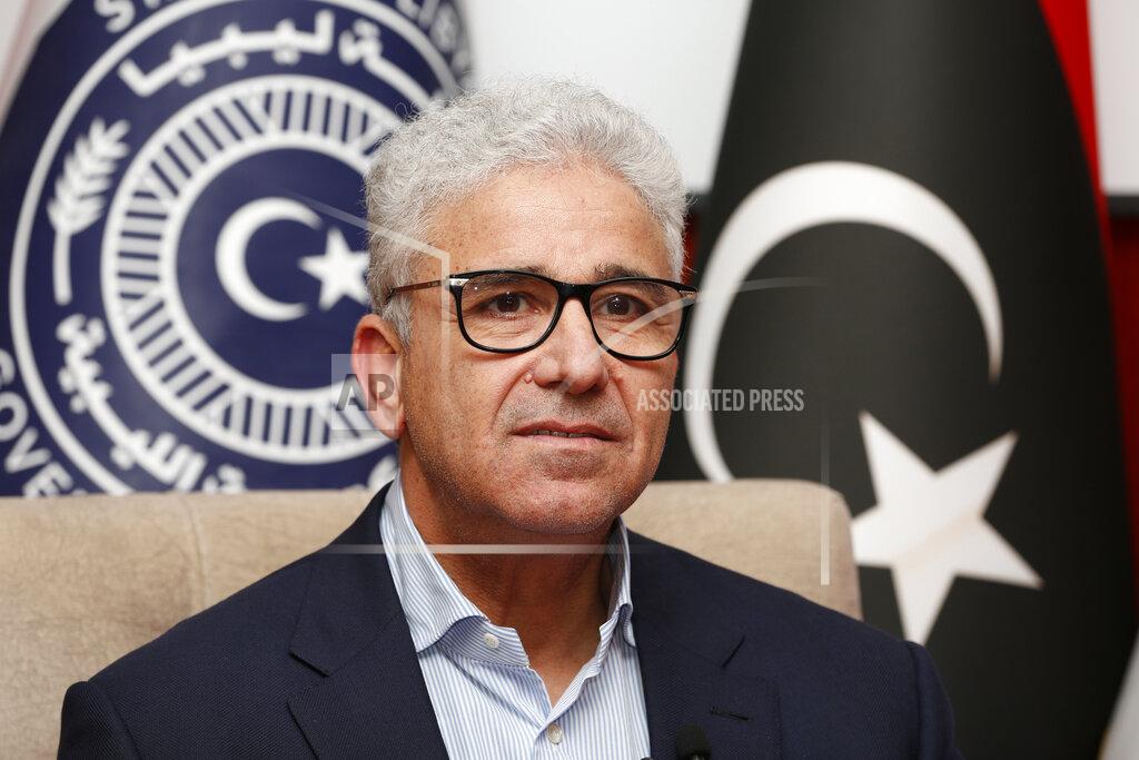 Yousef Murad Fathi Bashagha, one of Libya’s rival prime ministers, gives an interview to The Associated Press, in Sirte, Libya, Wednesday, May 25, 2022. In the interview Bashagha said that he has no immediate plans to return to the capital Tripoli and attempt to rule the country from there, after an attempt last week sparked clashes. His government will work from its headquarters in the city of Sirte — on Libya’s Mediterranean coast half-way between the country’s east and west. Rival administrations from each end of Libya claim to be its legitimate rulers until elections are held. (AP Photo/Yousef Murad)