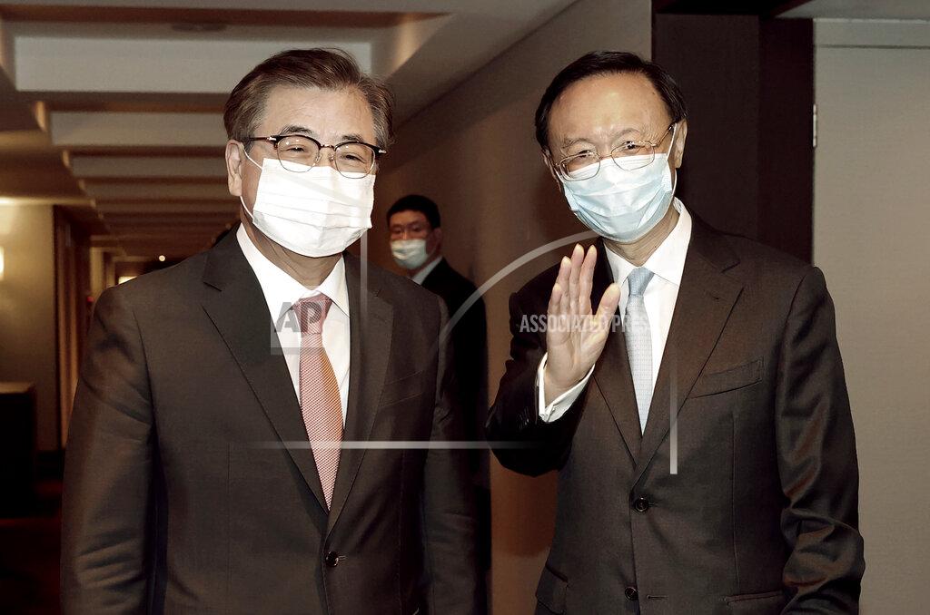 Lee Jin-Wook Yang Jiechi, right, a top Chinese official in charge of diplomatic affairs, and South Korean National Security Council Chairman Suh Hoon leave after their meeting at a hotel in Busan, South Korea, Saturday, Aug. 22, 2020. (Lee Jin-wook/Yonhap via AP)