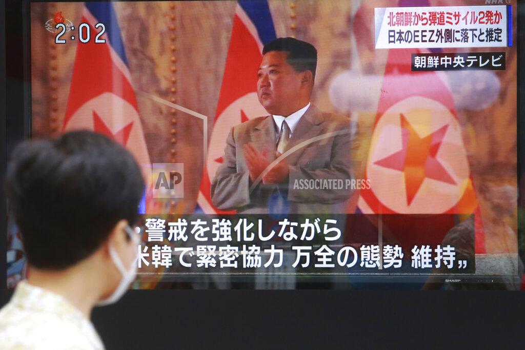 Koji Sasahara A man walks past a TV screen showing North Korean leader Kim Jong Un, in Tokyo, Wednesday, Sept. 15, 2021. North Korea fired two ballistic missiles into waters off its eastern coast Wednesday afternoon, two days after claiming to have tested a newly developed missile in a resumption of its weapons displays after a six-month lull. (AP Photo/Koji Sasahara)