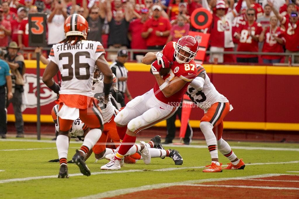 Charlie Riedel Kansas City Chiefs tight end Travis Kelce (87) scores as Cleveland Browns safety M.J. Stewart Jr. (36) watches during the second half of an NFL football game Sunday, Sept. 12, 2021, in Kansas City, Mo. (AP Photo/Charlie Riedel)