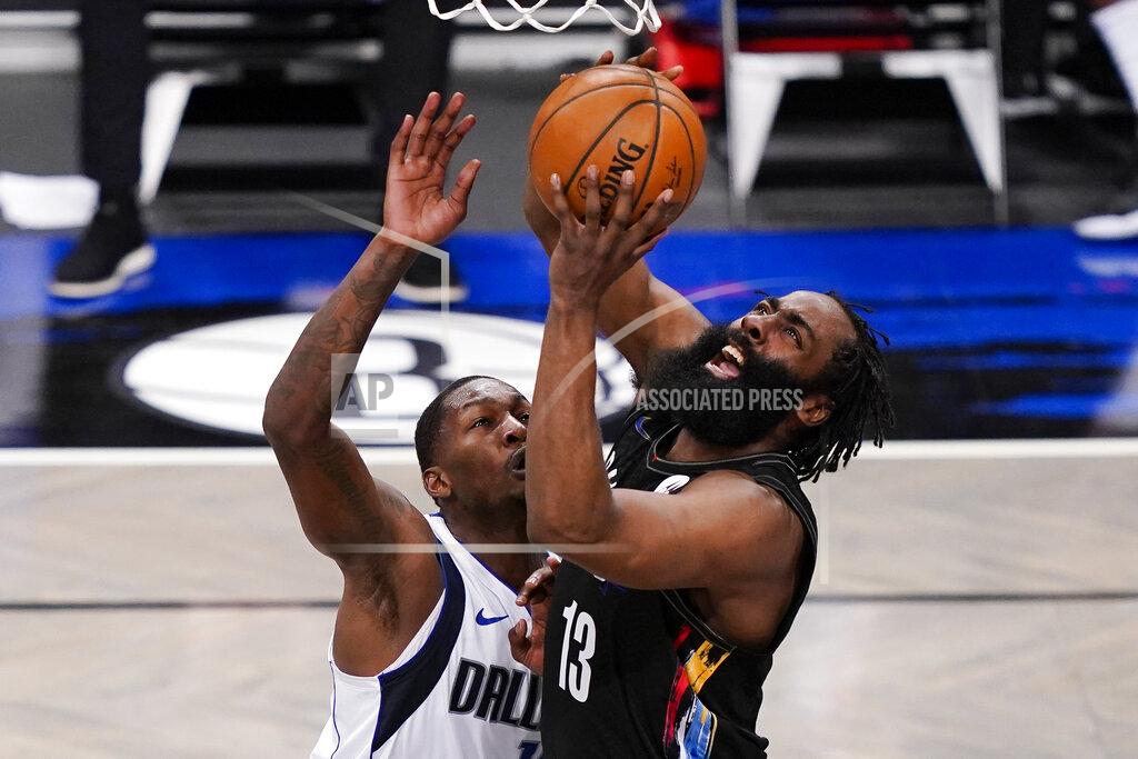John Minchillo Brooklyn Nets guard James Harden (13) shoots against Dallas Mavericks forward Dorian Finney-Smith during during the second half of an NBA basketball game Saturday, Feb. 27, 2021, in New York. (AP Photo/John Minchillo)