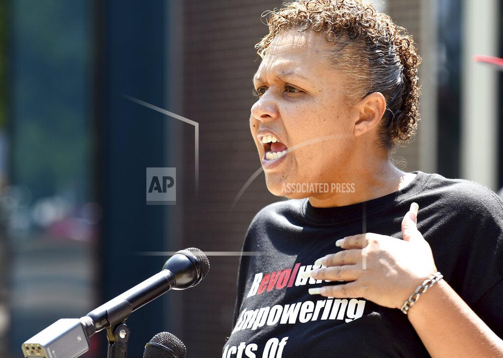 Thomas Peipert Community activist Candice Bailey speaks during a news conference in Aurora, Colorado, on Wednesday, July 28, 2021. Local activists and former members of Aurora's community police task force gathered to call attention to police brutality. Aurora police announced Monday that an officer was arrested after video showed him using his pistol to beat a man he was trying to take into custody, choking him and threatening to kill him, while another officer was accused of failing to stop her colleague. (AP Photo/Thomas Peipert)
