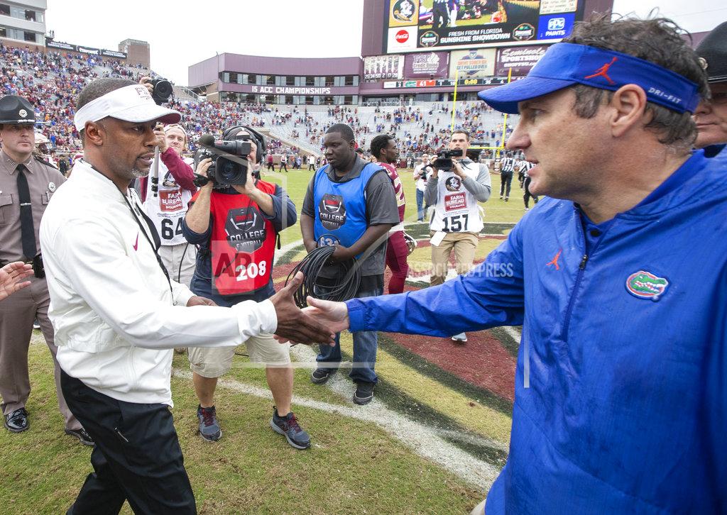 Mark Wallheiser Florida State head coach Willie Taggart, left, and Florida head coach Dan Mullen shake hands after Florida defeated Florida State 41-14 in an NCAA college football game in Tallahassee, Fla., Saturday, Nov. 24, 2018. Florida defeated Florida State 41-14. (AP Photo/Mark Wallheiser)