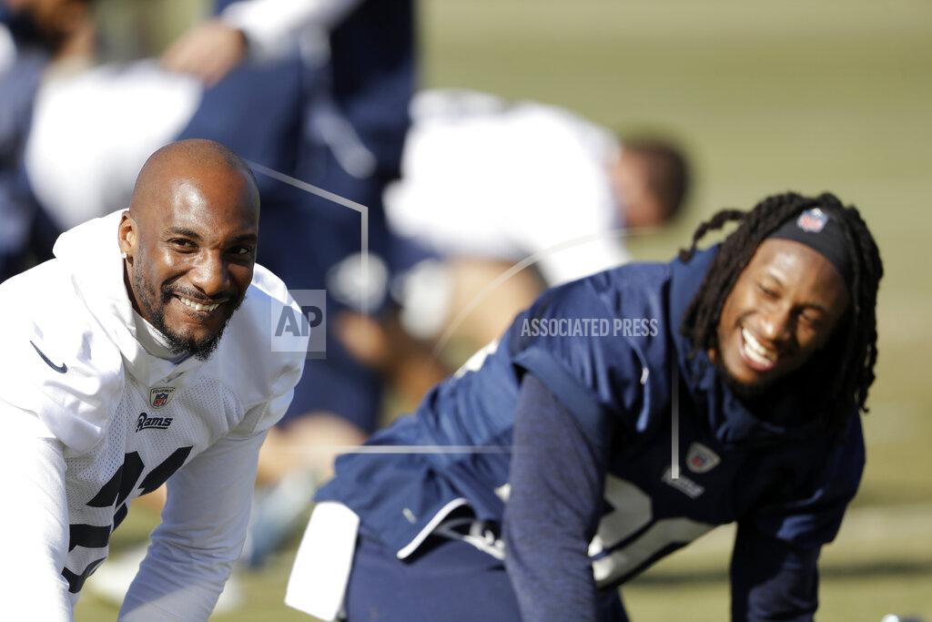 Los Angeles Rams' Aqib Talib, left, and Todd Gurley stretch during practice at their NFL football training facility Friday, Jan. 18, 2019, in Thousand Oaks, Calif. (AP Photo/Marcio Jose Sanchez)