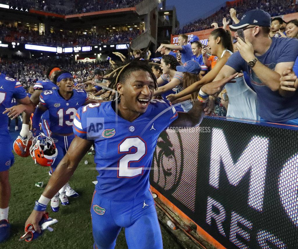 John Raoux Florida defensive back Brad Stewart Jr. (2) celebrates with fan after defeating LSU in an NCAA college football game, Saturday, Oct. 6, 2018, in Gainesville, Fla. Stewart intercepted an LSU pass in the final minutes of the game to help seal the win for Florida. (AP Photo/John Raoux)