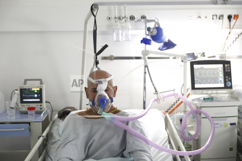 Uncredited A patient breathes through an oxygen mask at the COVID-19 ICU unit of the Dr. Abdulah Nakas General Hospital in Sarajevo, Bosnia, Friday, Sept. 17, 2021. The COVID-19 rate of infections in Bosnia, a country where only about 12% of the population is fully vaccinated against COVID-19, is on the rise, authorities reported on Friday, with more than 900 new infections and 30 fatalities over the past 24 hours. (AP Photo)