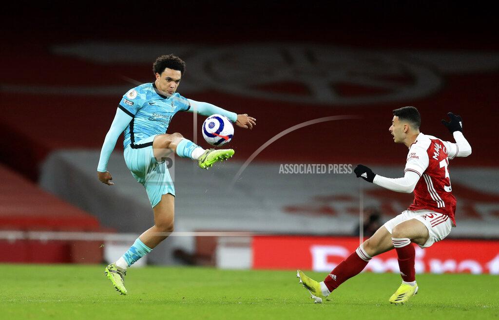 Adam Davy Arsenal's Gabriel Martinelli, right, challenges Liverpool's Trent Alexander-Arnold during the English Premier League soccer match between Arsenal and Liverpool at the Emirates Stadium in London, England, Saturday, April 3, 2021. (Adam Davy/Pool via AP)