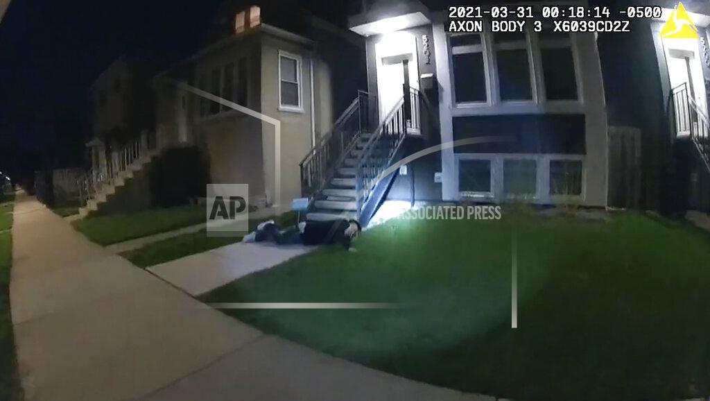 Uncredited In this image taken from Chicago Police body cam video from early Wednesday, March 31, 2021, Anthony Alvarez lies on the ground after a police foot chase in Chicago. Alvarez was fatally shot by police during the incident. Police claim Alvarez, 22, brandished a gun while being chased. (Civilian Office of Police Accountability via AP)