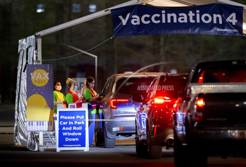 David Grunfeld Ochsner nurses and volunteers give a Moderna COVID-19 vaccine at 5 a.m. during the 24-hour Max Fest at the Shrine on Airline Metairie near New Orleans Tuesday, March 30, 2021. Anyone who does not have an appointment can show up and get a vaccine until 7 a.m. this morning. (David Grunfeld/The Advocate via AP)