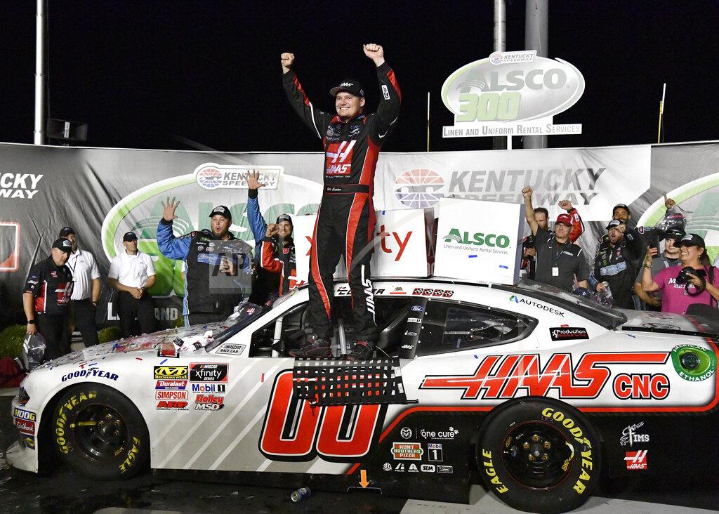 Timothy D. Easley Cole Custer raises his hands after winning a NASCAR Xfinity Series auto race at Kentucky Speedway in Sparta, Ky., Friday, July 12, 2019. (AP Photo/Timothy D. Easley)